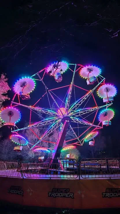 Super Trooper family thrill ride illuminated at night